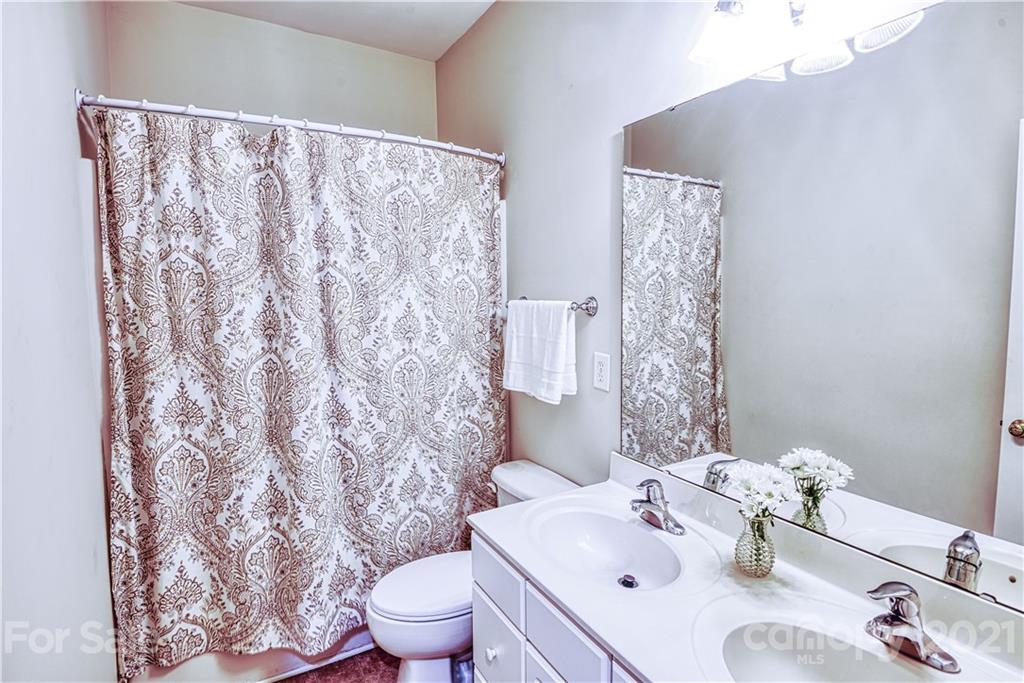 1380 Barnett Woods Fort Mill, SC 29708 - Photo 24 of 31 a bathroom with a sink toilet and shower