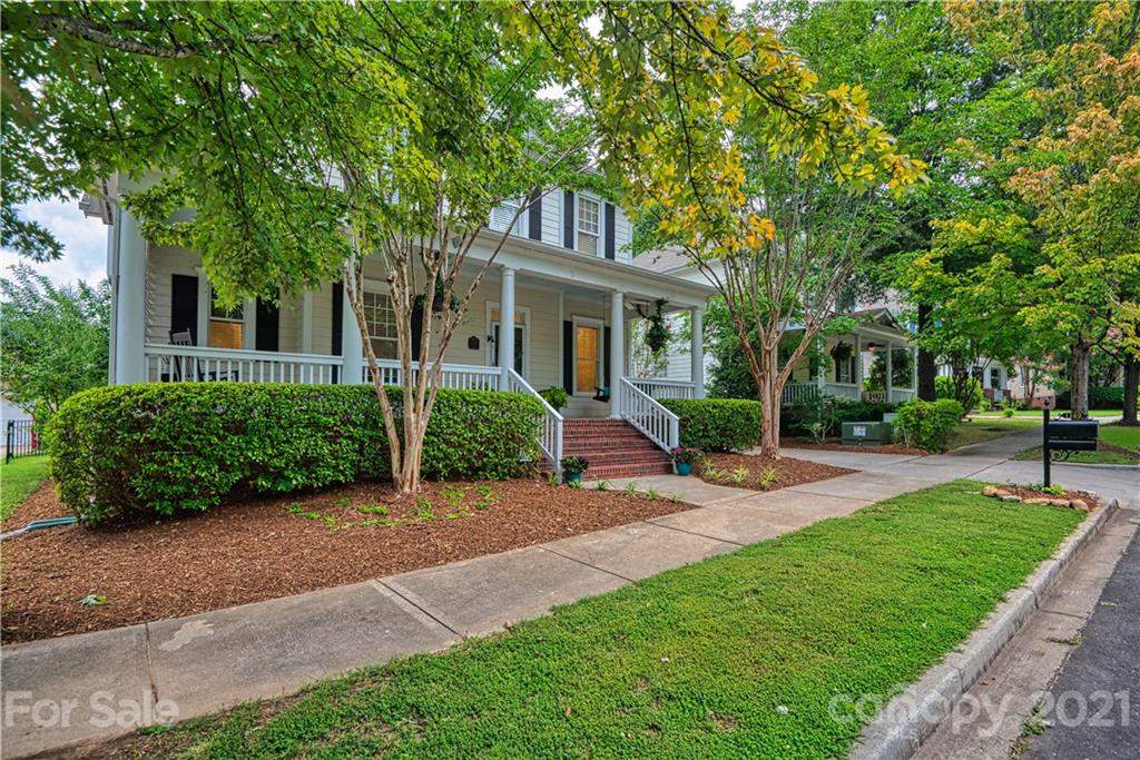 1380 Barnett Woods Fort Mill, SC 29708 - Photo 4 of 31 a front view of a house with a yard