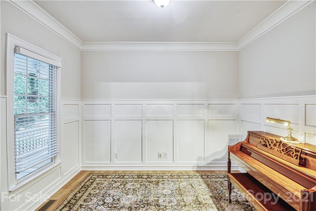 1380 Barnett Woods Fort Mill, SC 29708 - Photo 6 of 31 a view of a bedroom with wooden floor and white walls