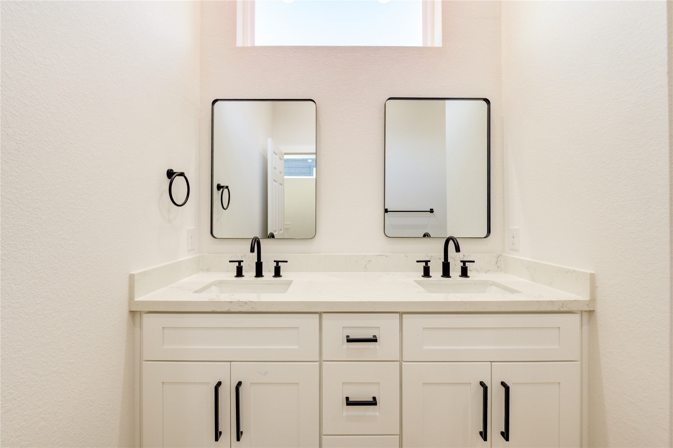1207 Dewalt Street Houston, TX 77088 - Photo 19 of 26 a bathroom with double vanity sinks and a mirror