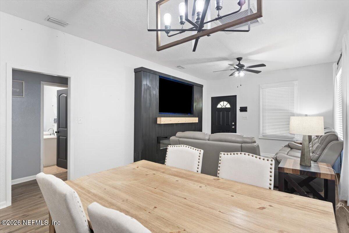 45116 Kilpatrick Road Callahan, FL 32011 - Photo 11 of 41 a bedroom with a bed and a flat tv screen on the dresser