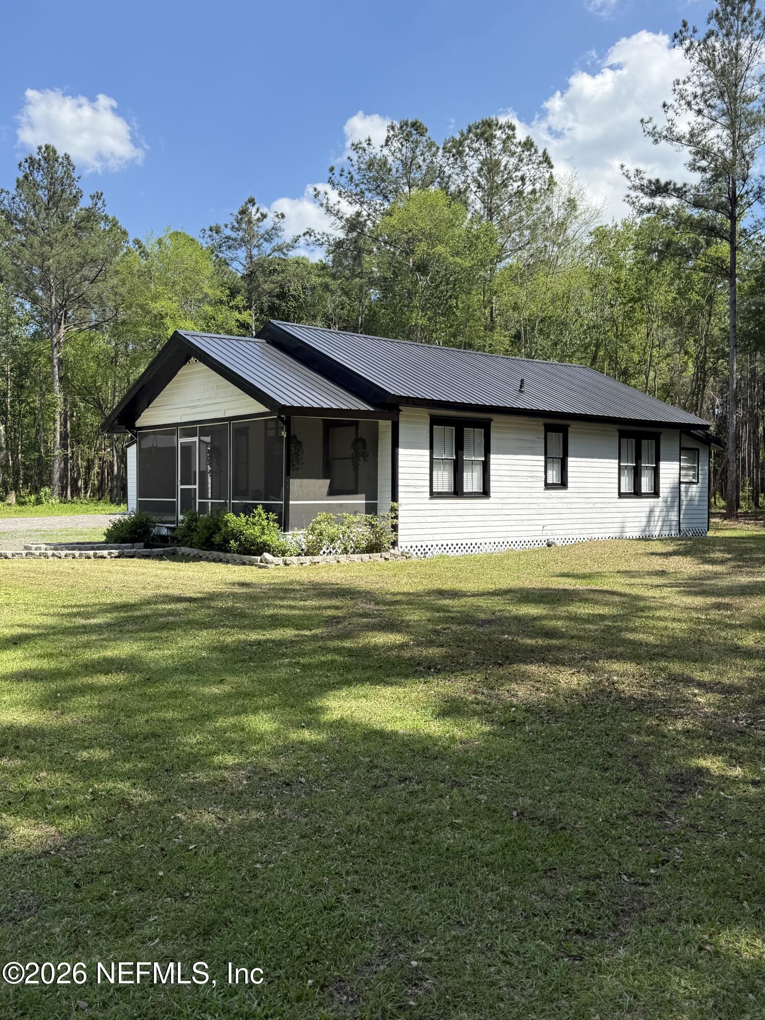 45116 Kilpatrick Road Callahan, FL 32011 - Photo 2 of 41 a front view of a house with garden