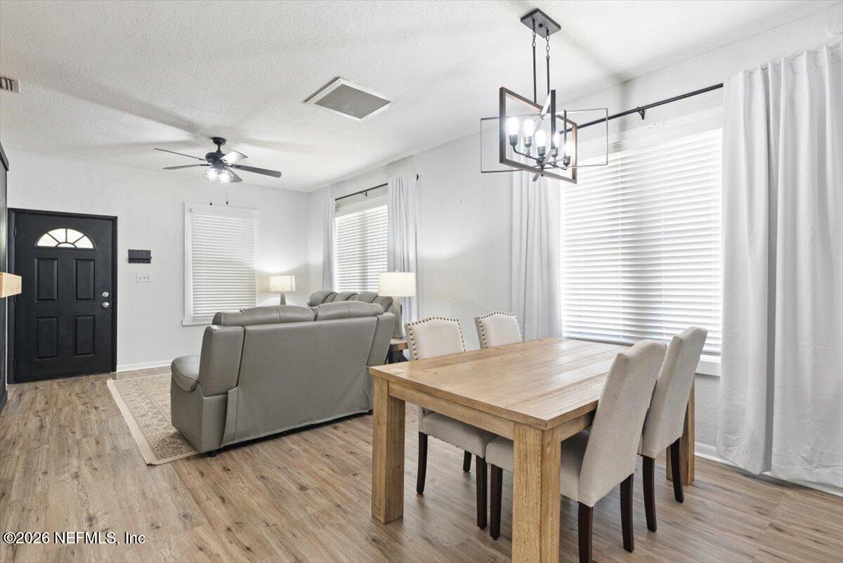 45116 Kilpatrick Road Callahan, FL 32011 - Photo 10 of 41 a view of a dining room with furniture window and wooden floor