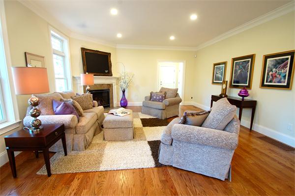 27 Leewood Road Wellesley, MA 02482 - Photo 2 of 17 a living room with fireplace furniture and a flat screen tv