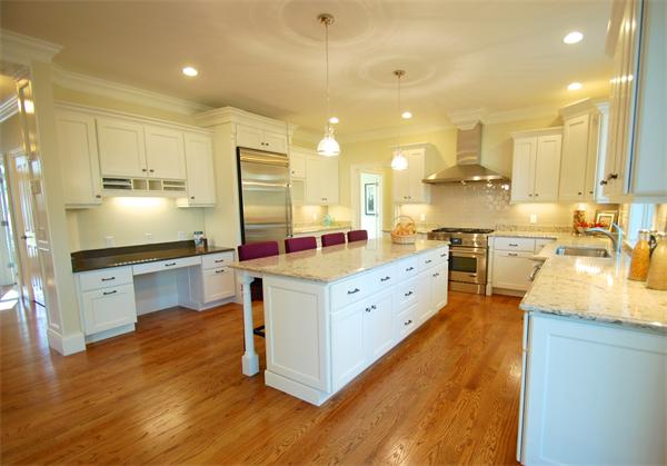 27 Leewood Road Wellesley, MA 02482 - Photo 8 of 17 a kitchen with stainless steel appliances sink cabinets and wooden floor