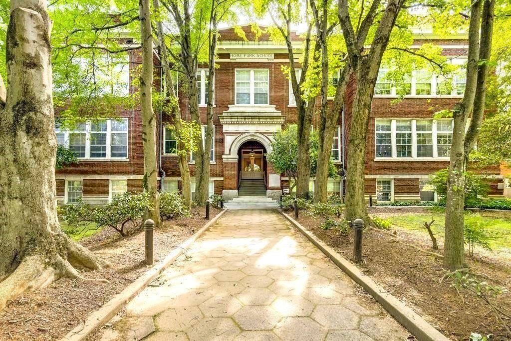 a view of a house with swimming pool and sitting area