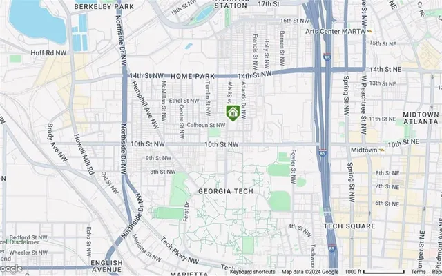 a living room with furniture fireplace and a large window