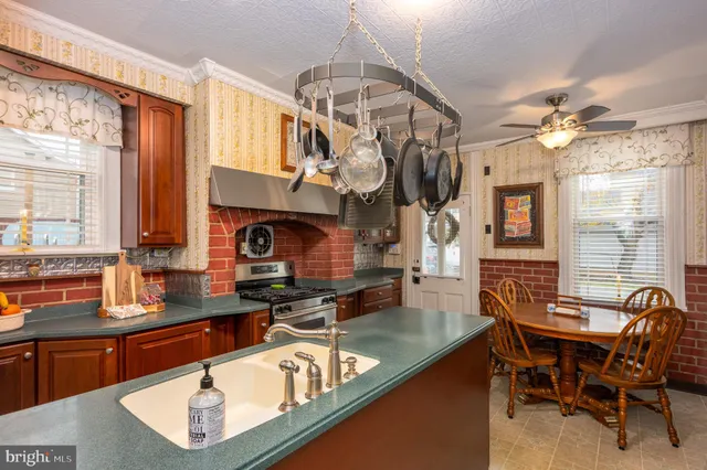 a living room with furniture a lamp and a chandelier