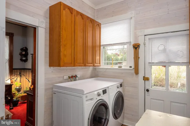 a view of a workspace with furniture and gym equipment