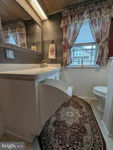 a view of house with yard in front of house