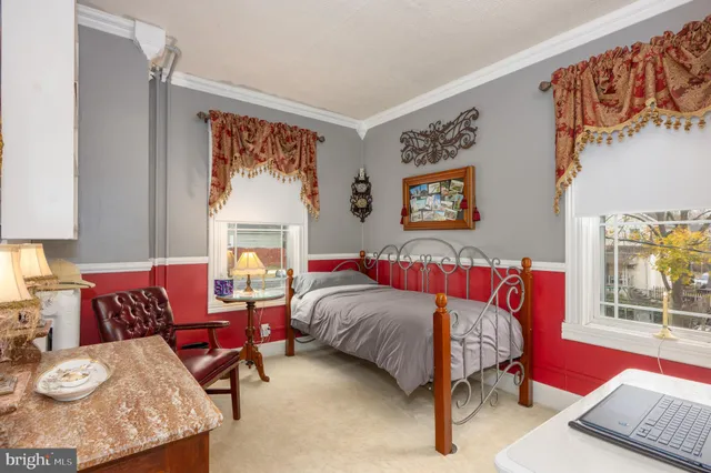 a view of a house with cars park