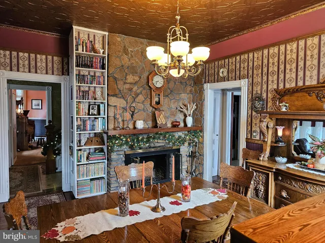 a living room with furniture a large window and a flat screen tv