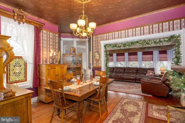 a kitchen with stainless steel appliances granite countertop a sink counter space and a table