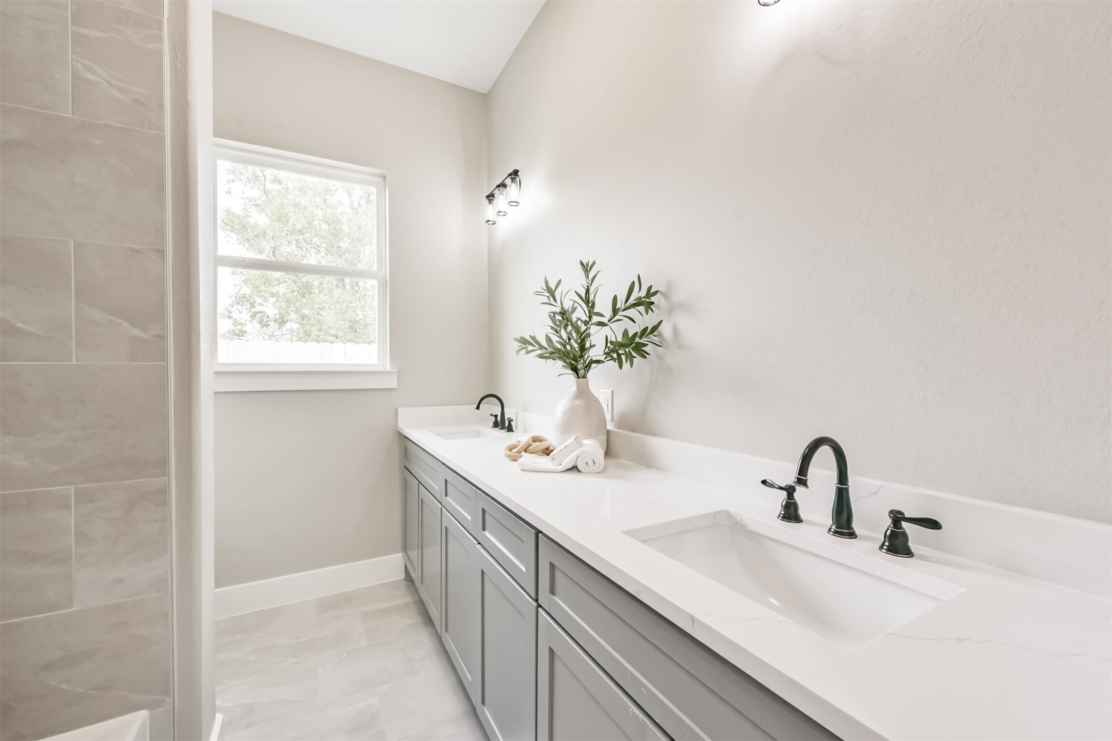 2803 Lancaster Lane Pasadena, TX 77506 - Photo 35 of 45 a bathroom with a double vanity sink and a mirror