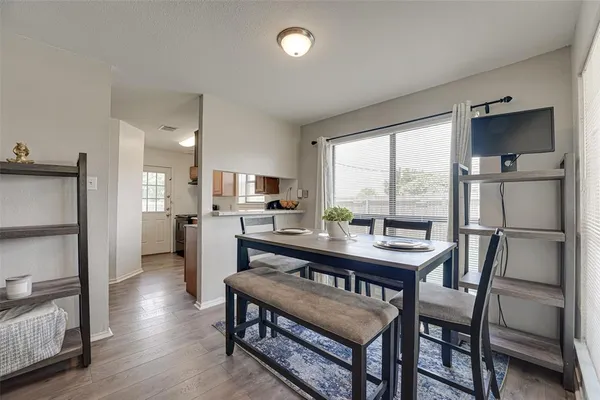 a view of a dining room with furniture window and wooden floor