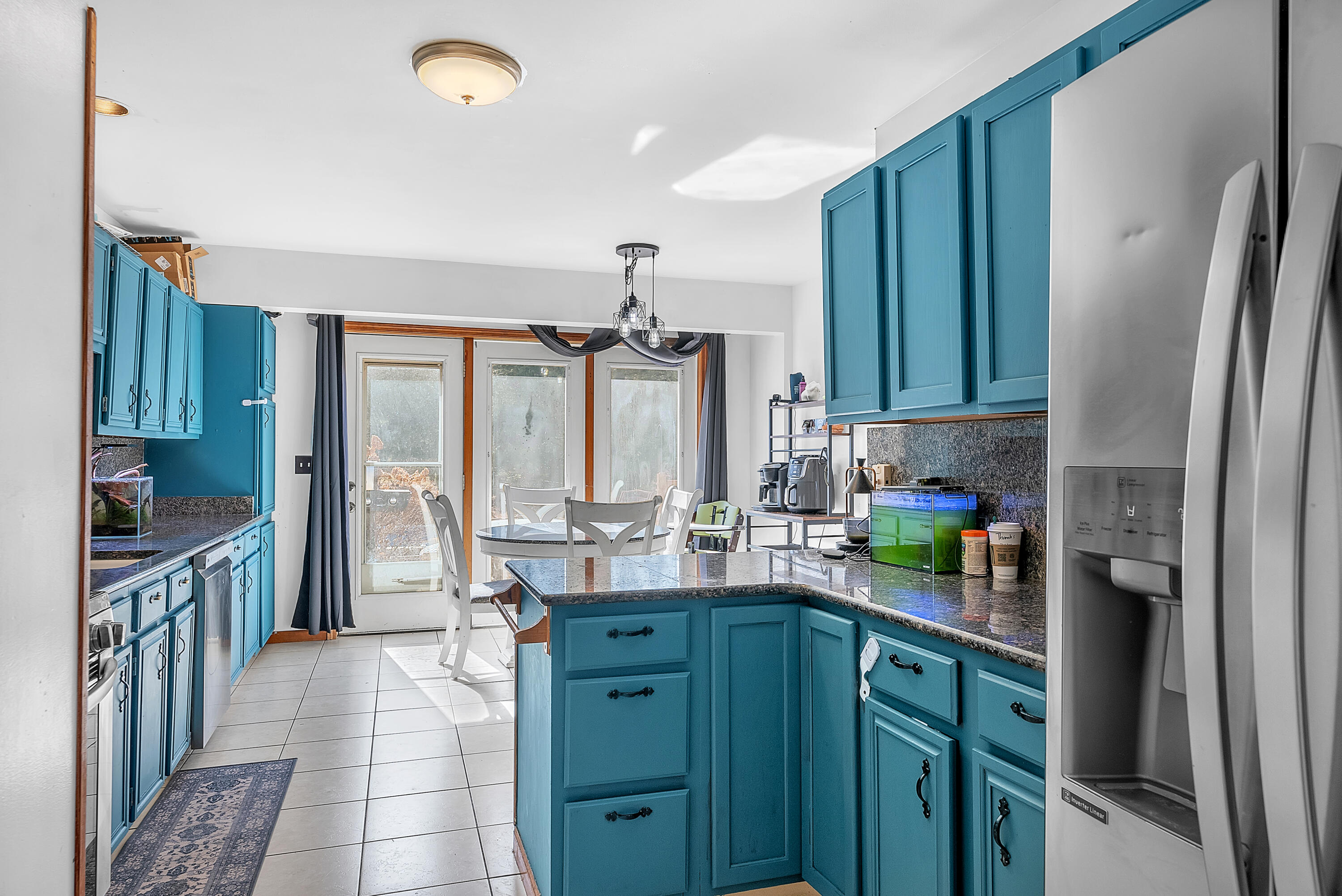 5351 East Honor Avenue Demotte, IN 46310 - Photo 11 of 31 a kitchen with kitchen island granite countertop a sink stove and refrigerator