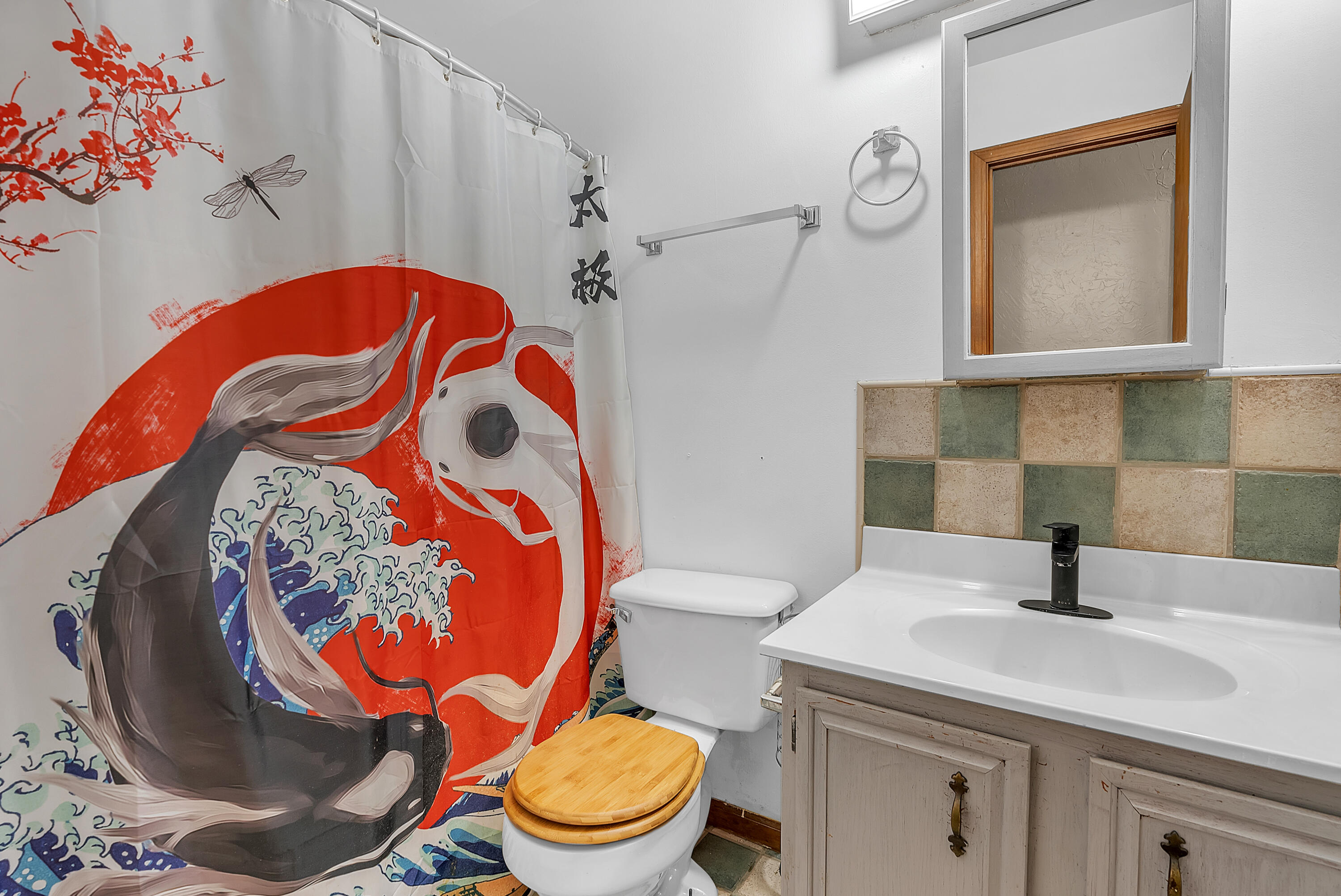 5351 East Honor Avenue Demotte, IN 46310 - Photo 16 of 31 a bathroom with a toilet sink and mirror