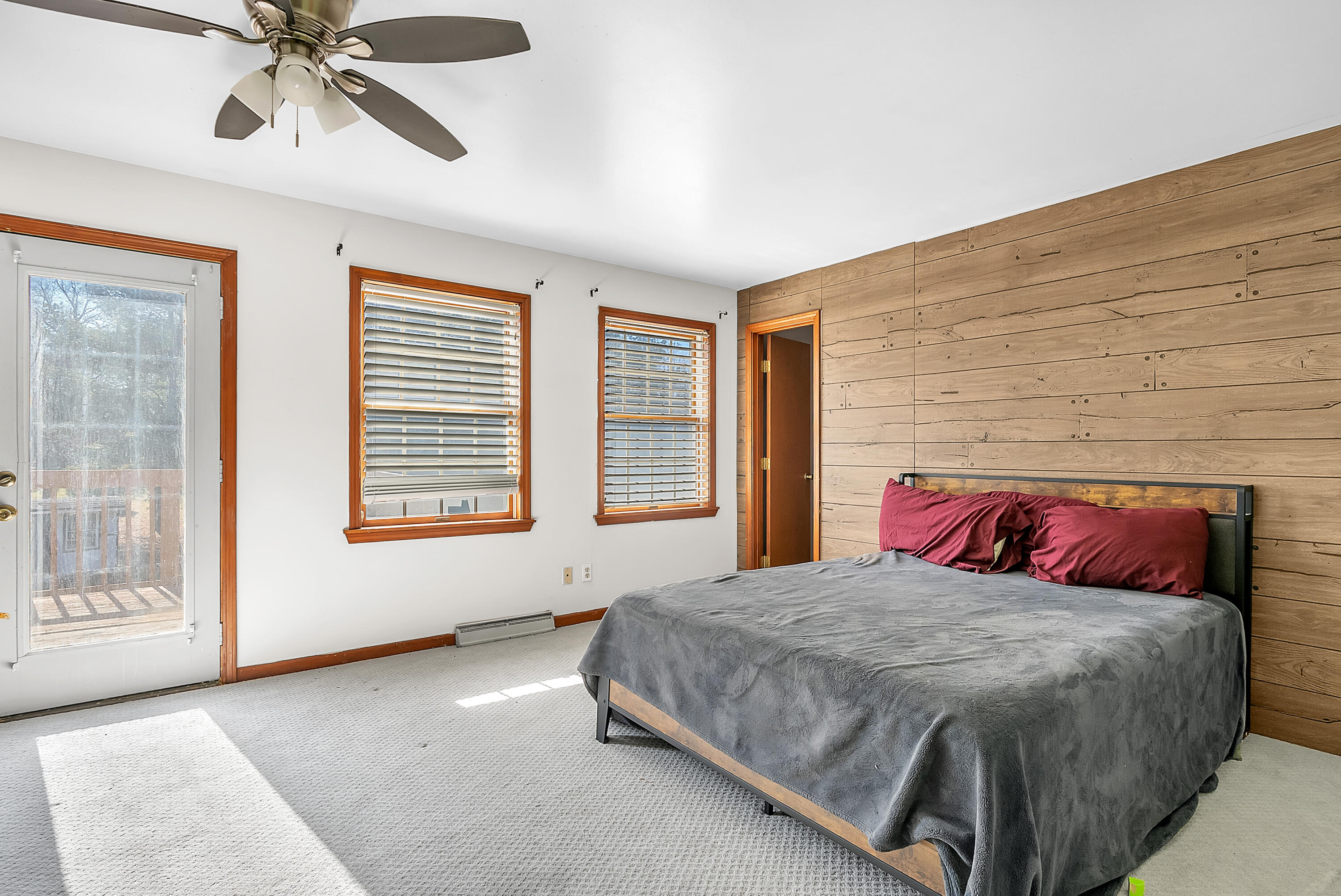 5351 East Honor Avenue Demotte, IN 46310 - Photo 18 of 31 a bedroom with a large bed and a chandelier fan