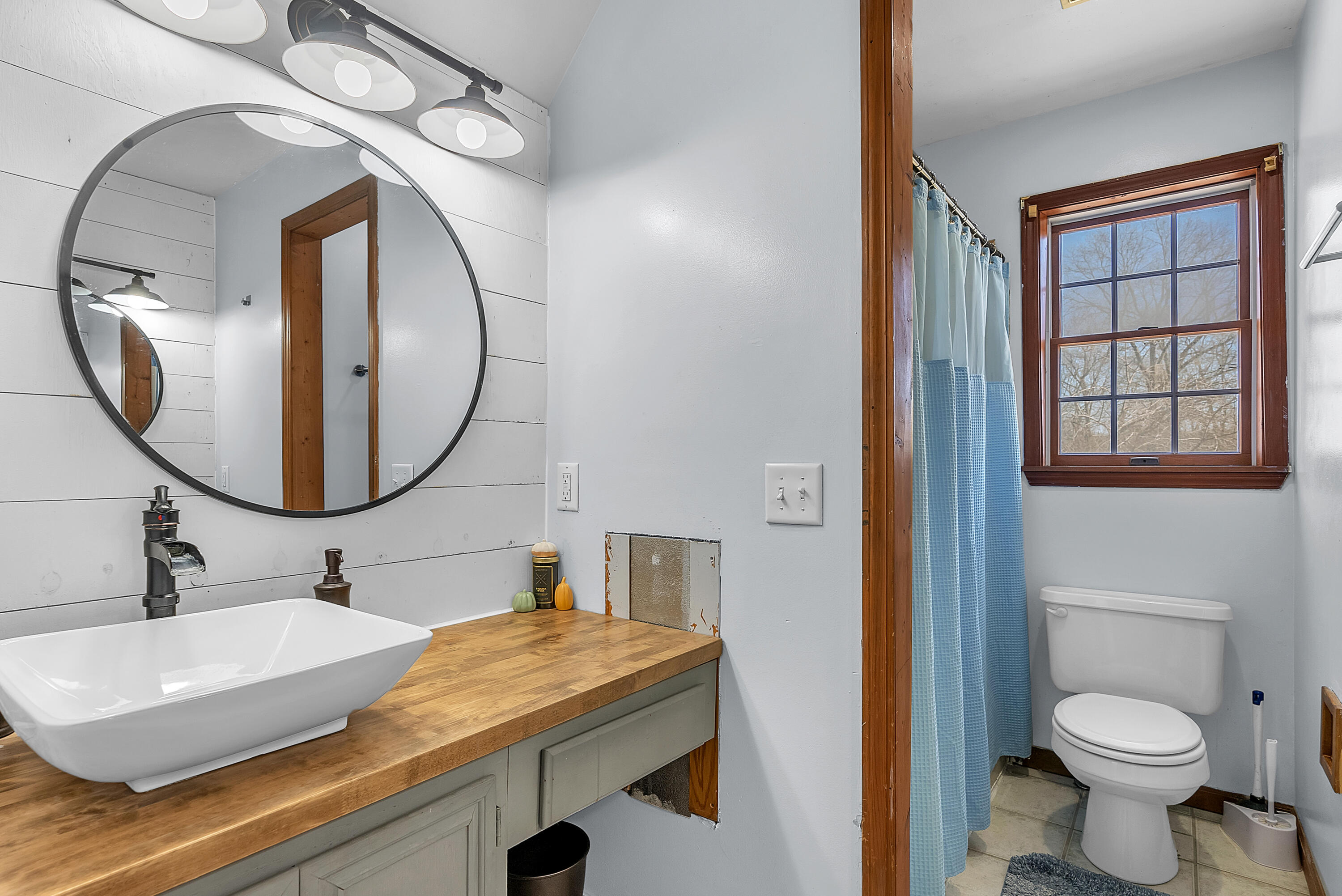 5351 East Honor Avenue Demotte, IN 46310 - Photo 20 of 31 a bathroom with a sink a toilet and a mirror