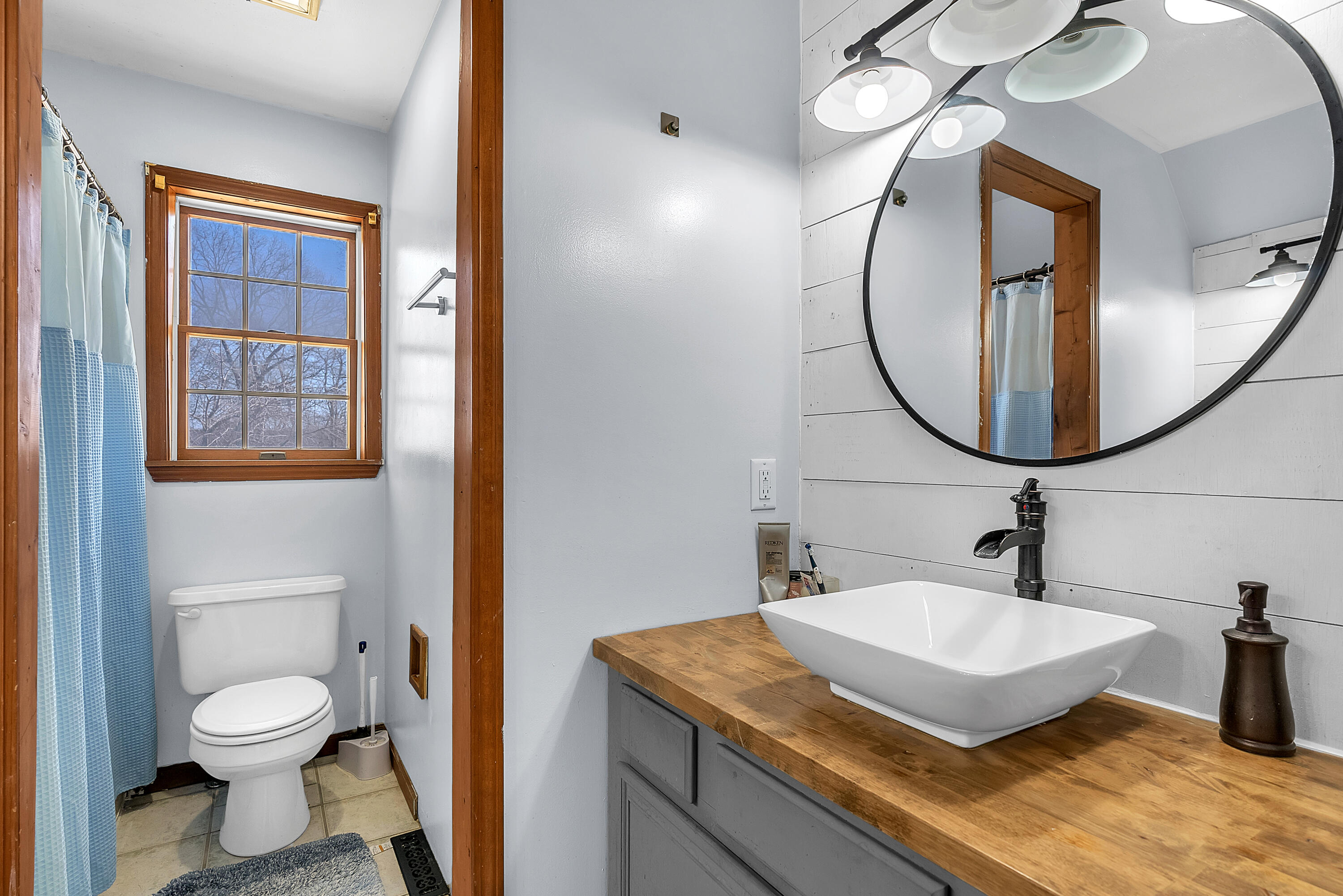 5351 East Honor Avenue Demotte, IN 46310 - Photo 21 of 31 a bathroom with a granite countertop sink and a mirror