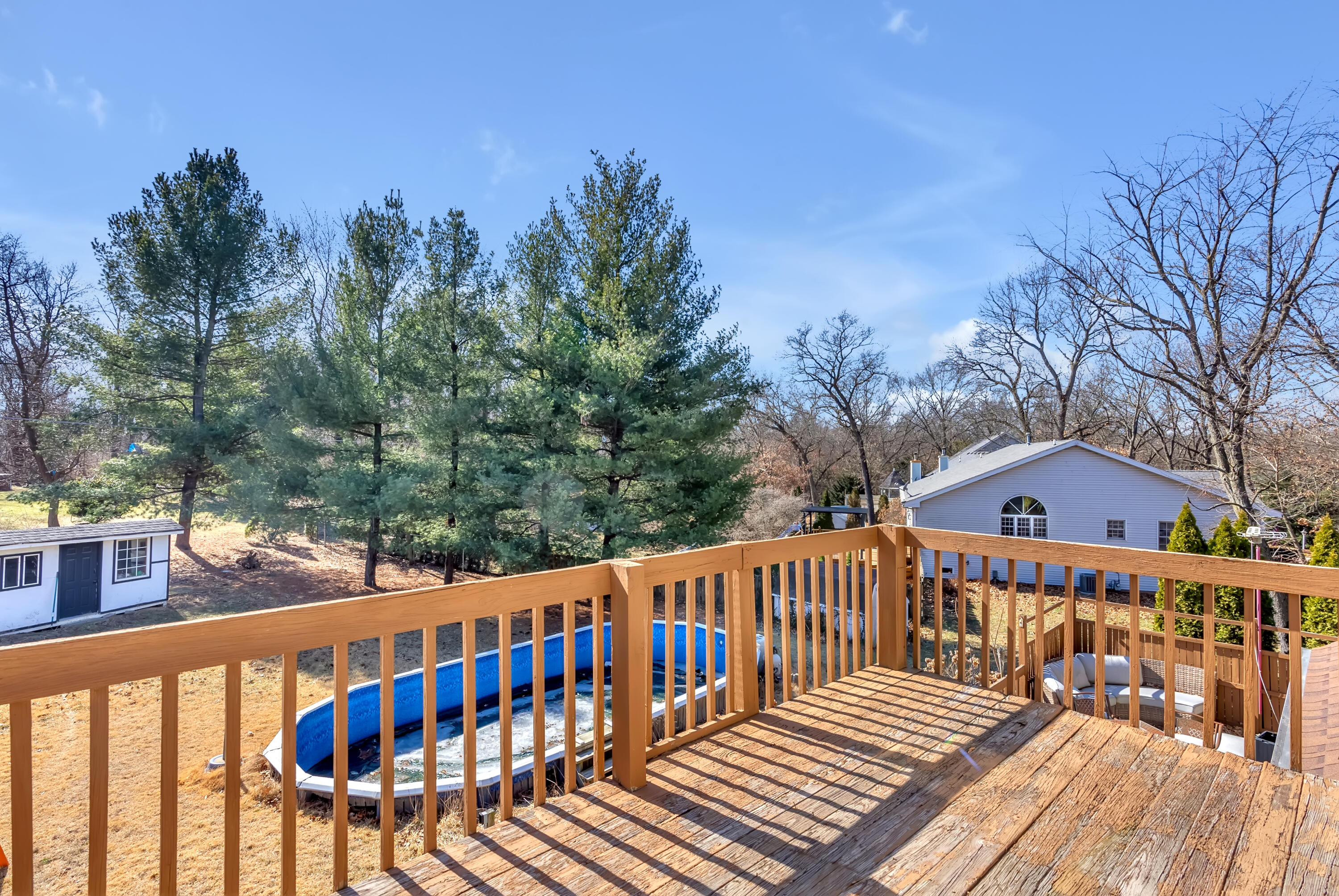 5351 East Honor Avenue Demotte, IN 46310 - Photo 22 of 31 a view of a wooden deck with a bench