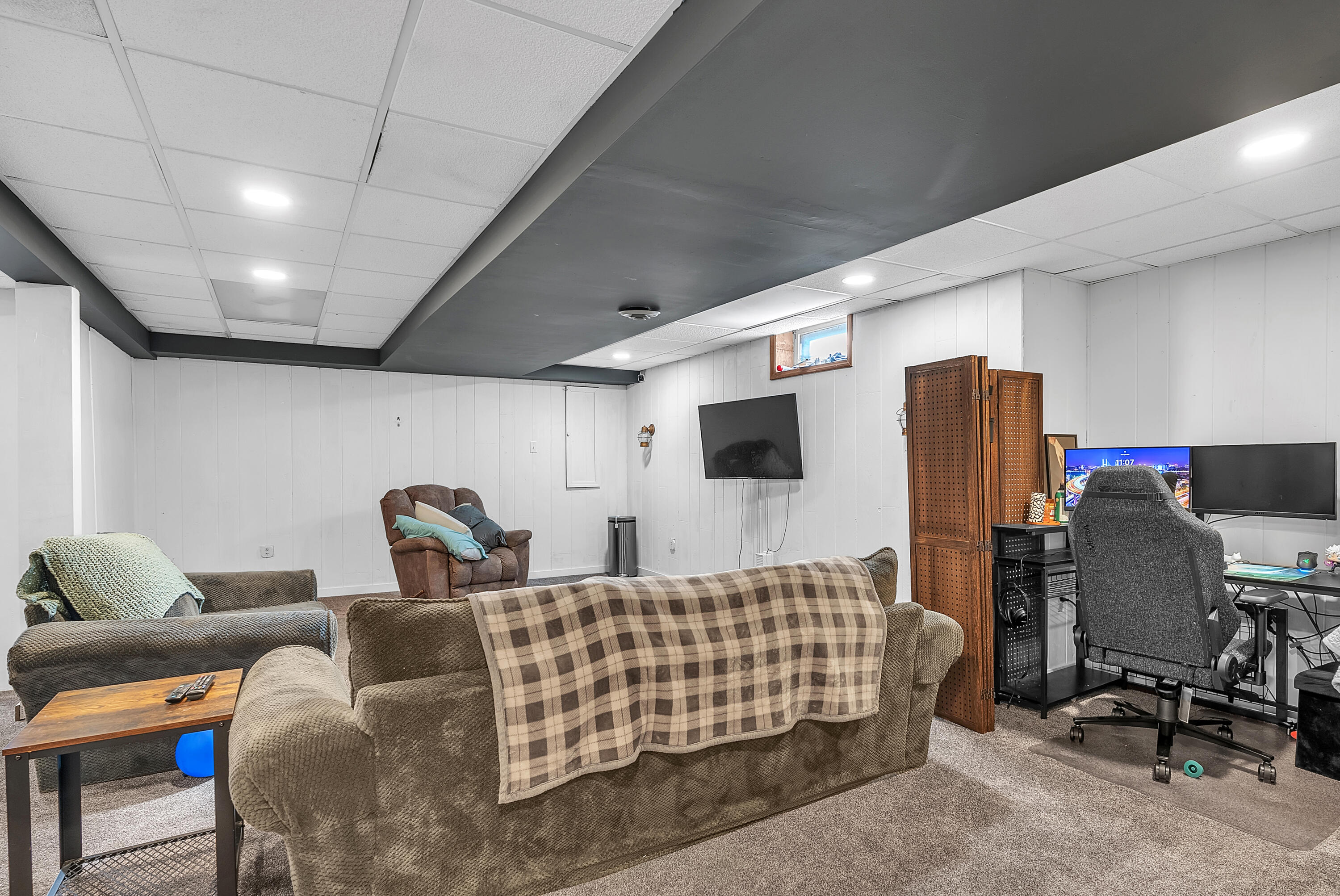 5351 East Honor Avenue Demotte, IN 46310 - Photo 25 of 31 a living room with furniture and a flat screen tv