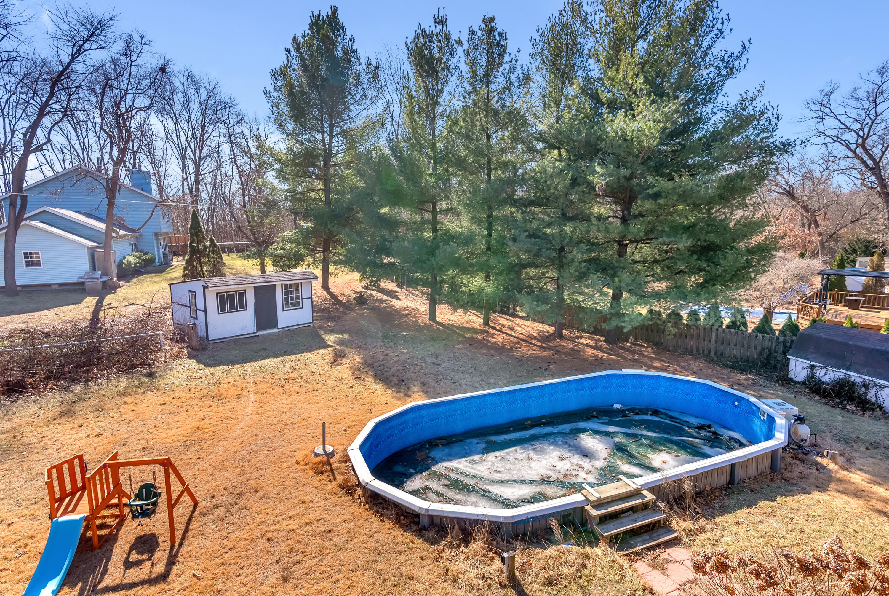 5351 East Honor Avenue Demotte, IN 46310 - Photo 28 of 31 a view of a swimming pool with a patio