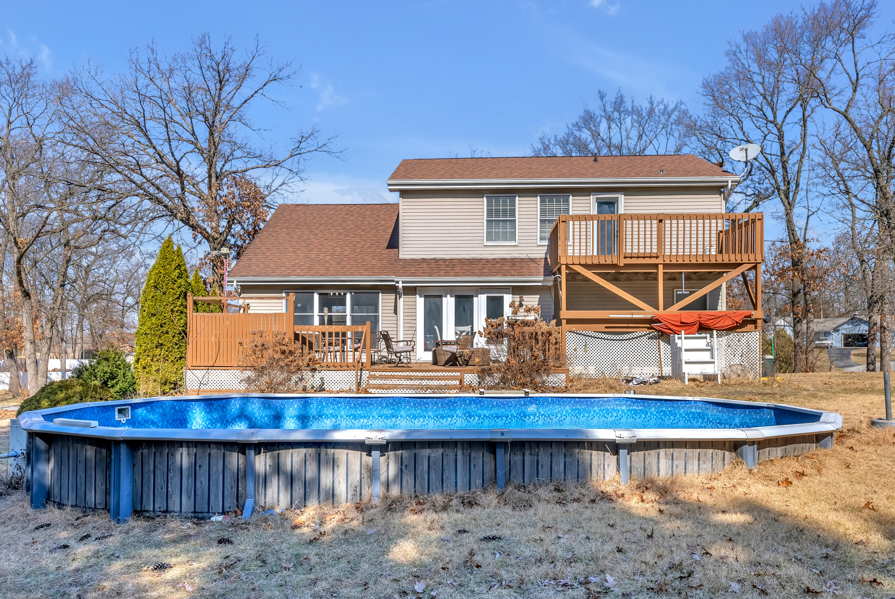 5351 East Honor Avenue Demotte, IN 46310 - Photo 29 of 31 a front view of a house with swimming pool table and chairs