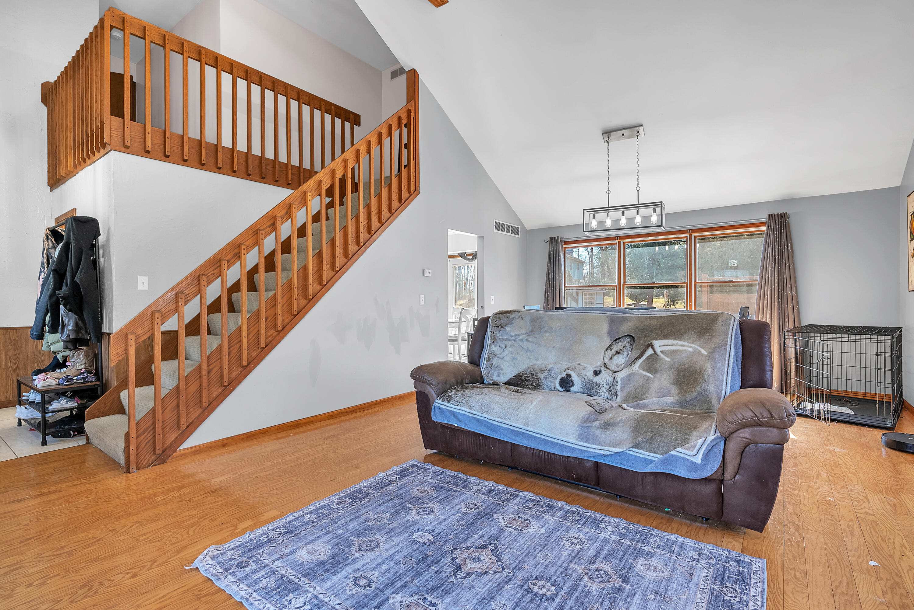 5351 East Honor Avenue Demotte, IN 46310 - Photo 6 of 31 a living room with furniture or stairs and a rug