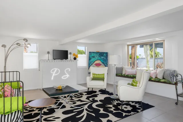 a bedroom with a bed and a lamp