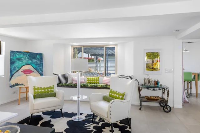 a bathroom with a sink vanity mirror and toilet