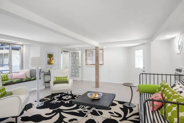 a bathroom with a shower sink vanity and mirror