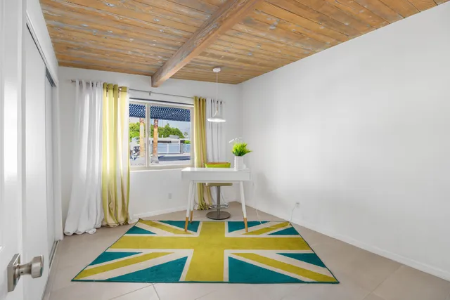 a view of a chairs and table in the patio