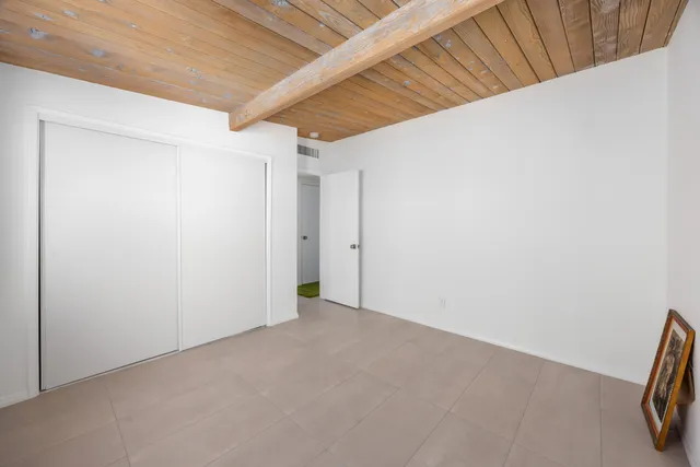 a patio with a table and chairs