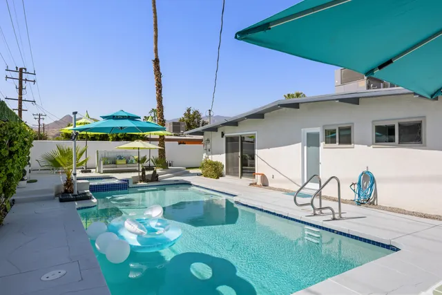 an aerial view of residential houses and outdoor space