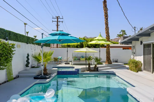 a view of a palm trees in front of a building