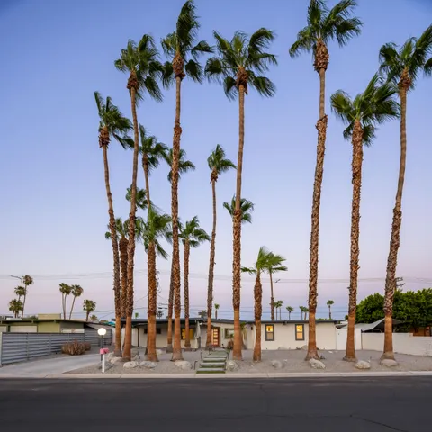 swimming pool view with a seating space