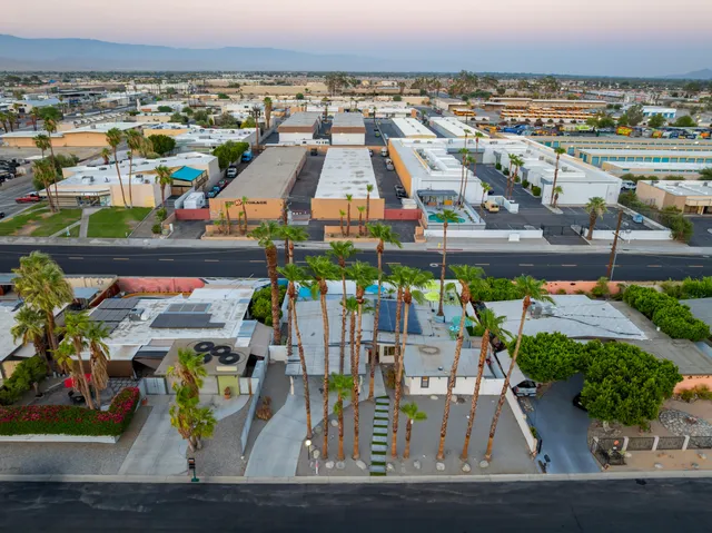 a front view of a house with sitting area