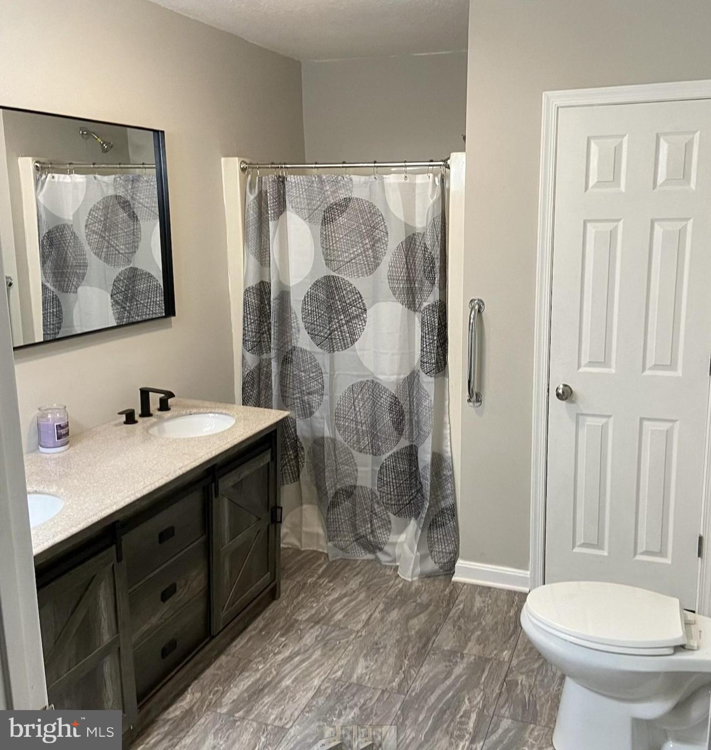 503 Pomeroy Road Front Royal, VA 22630 - Photo 20 of 41 a bathroom with a double vanity sink toilet and shower