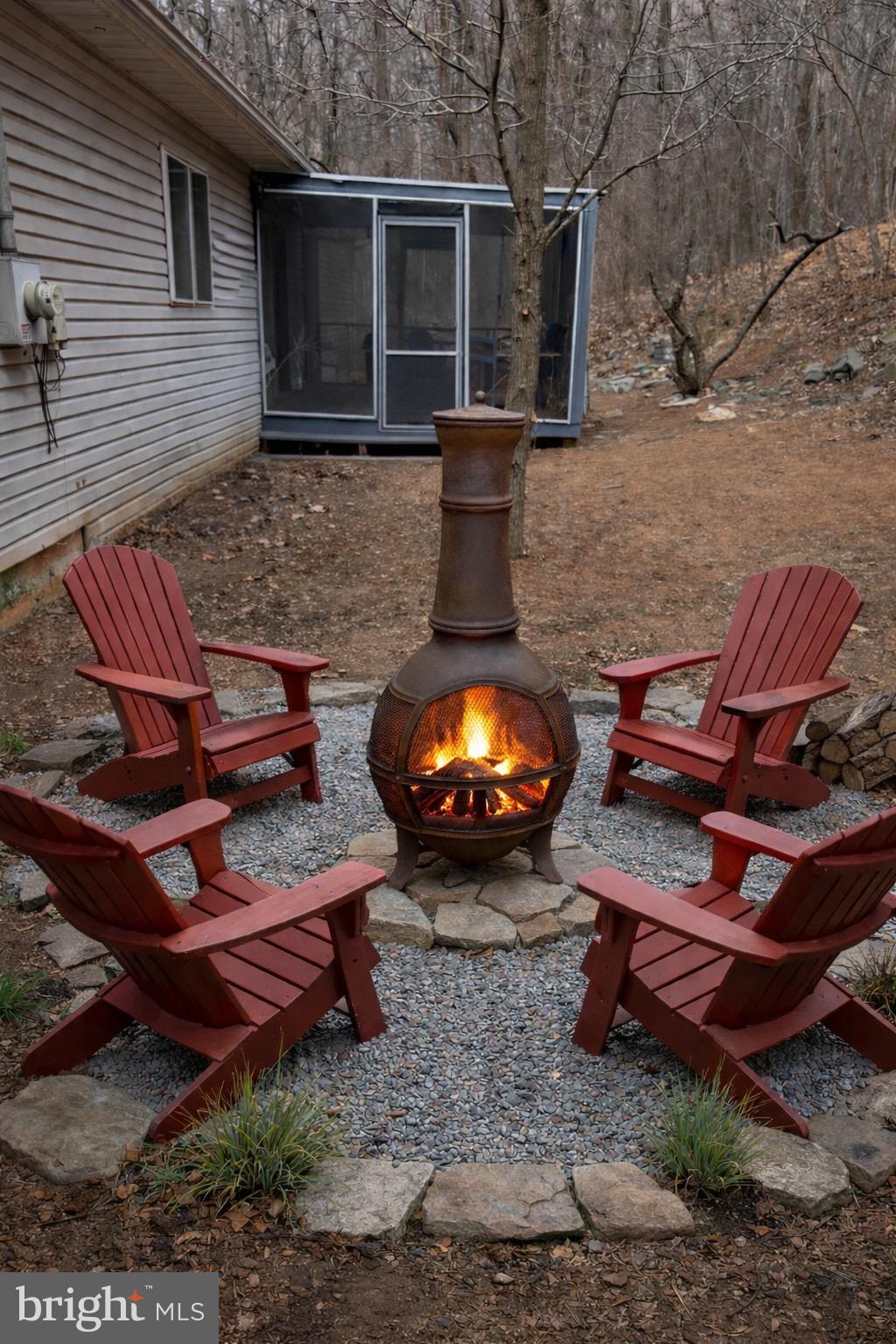 503 Pomeroy Road Front Royal, VA 22630 - Photo 29 of 41 a backyard of a house with barbeque oven table and chairs