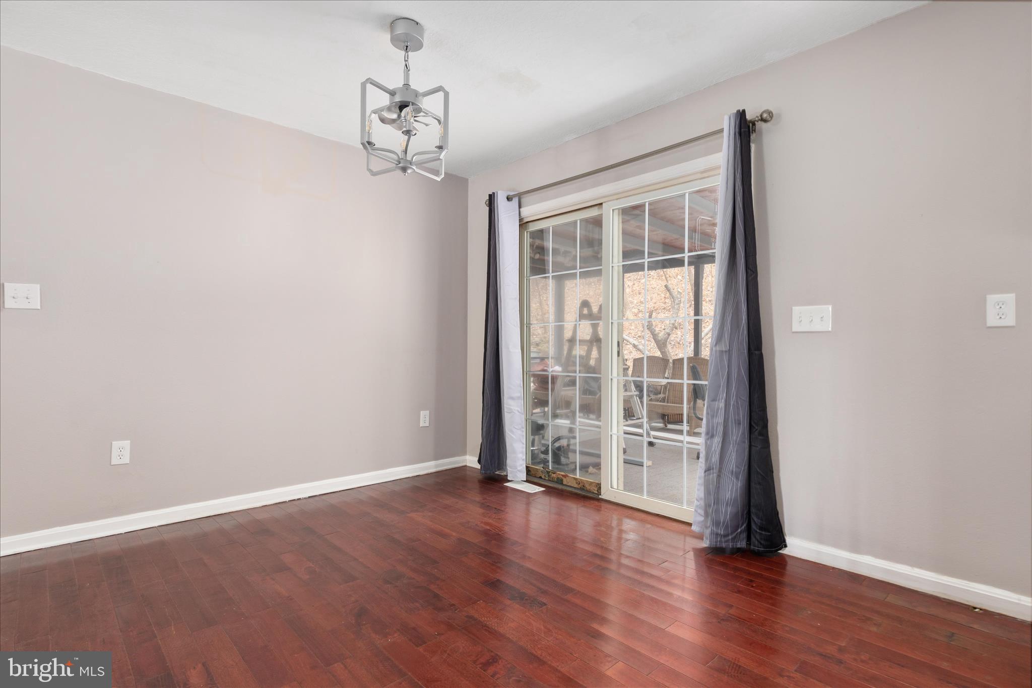 503 Pomeroy Road Front Royal, VA 22630 - Photo 6 of 41 wooden floor in an empty room with a window