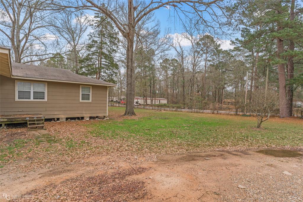 158 Edwards Road Doyline, LA 71023 - Photo 26 of 28 a backyard of a house with lots of green space