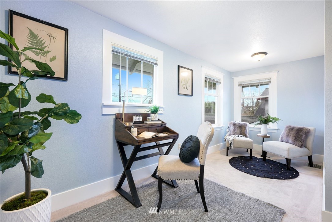 1509 Rucker Avenue Everett, WA 98201 - Photo 19 of 39 a living room with furniture potted plant and a window