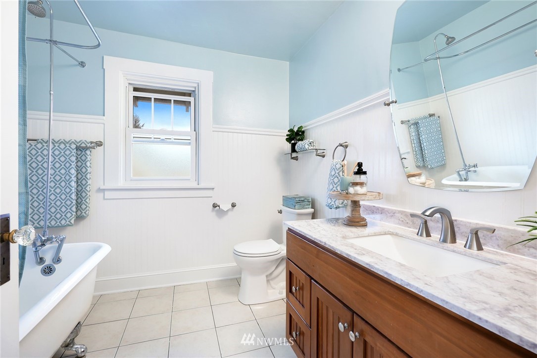 1509 Rucker Avenue Everett, WA 98201 - Photo 20 of 39 a bathroom with a sink a toilet and shower