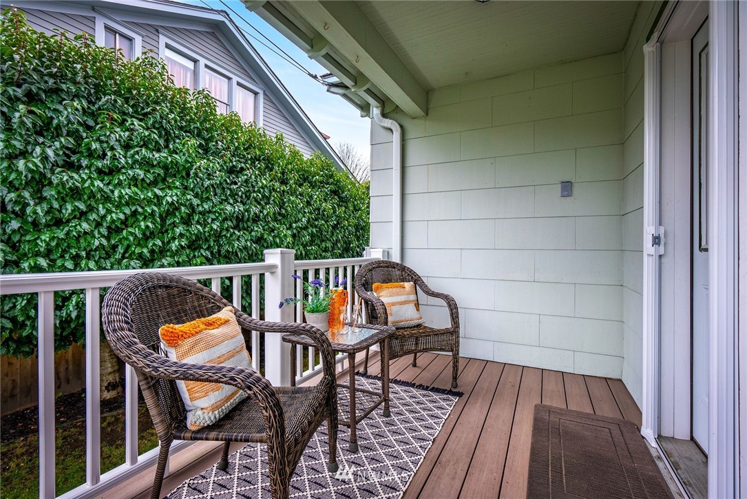 1509 Rucker Avenue Everett, WA 98201 - Photo 23 of 39 a balcony with wooden floor stairs and furniture