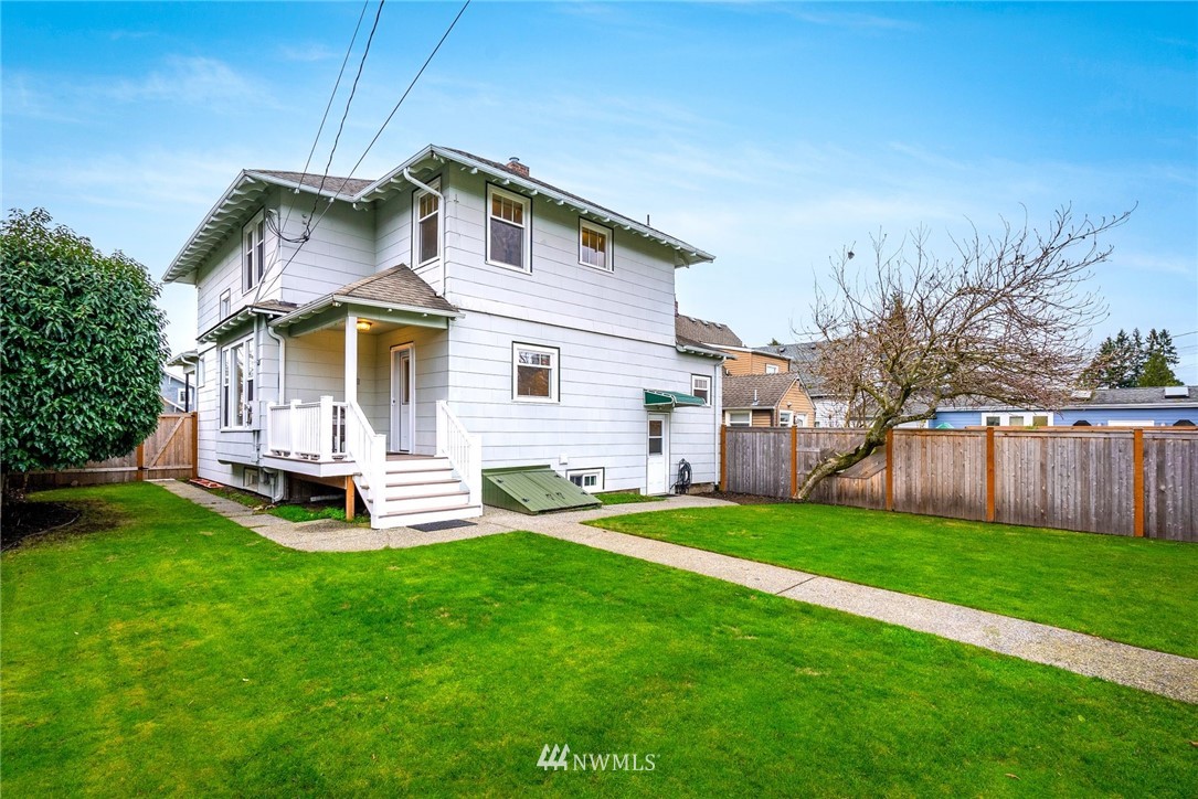 1509 Rucker Avenue Everett, WA 98201 - Photo 24 of 39 a view of a house with a yard and sitting area