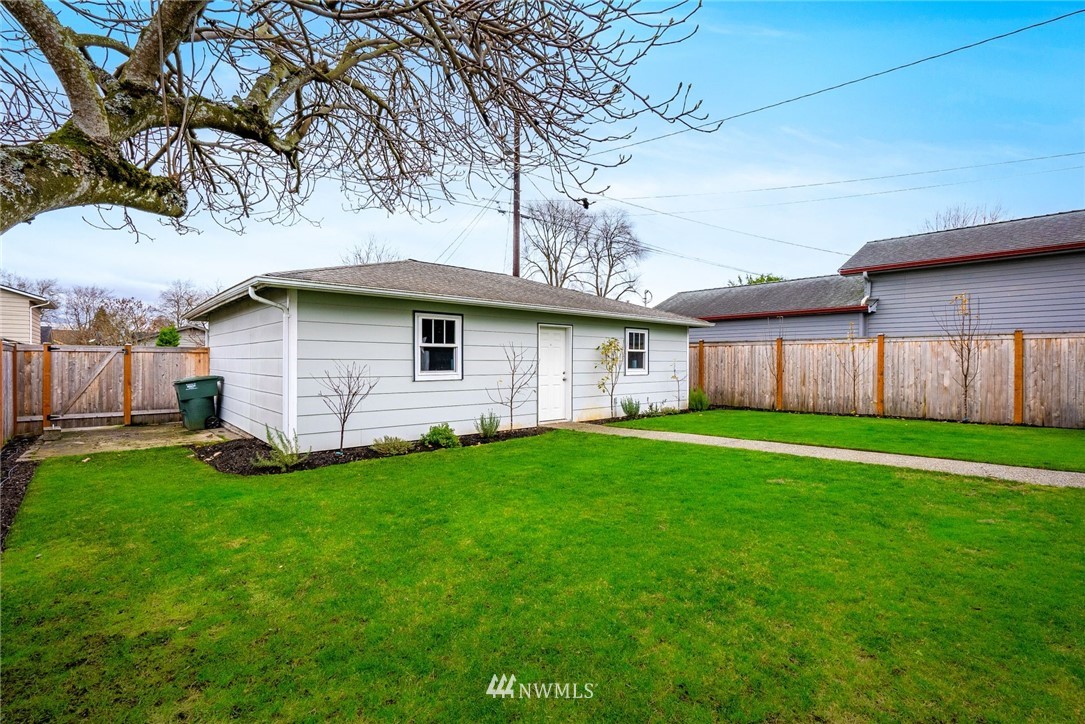 1509 Rucker Avenue Everett, WA 98201 - Photo 27 of 39 a front view of a house with a garden