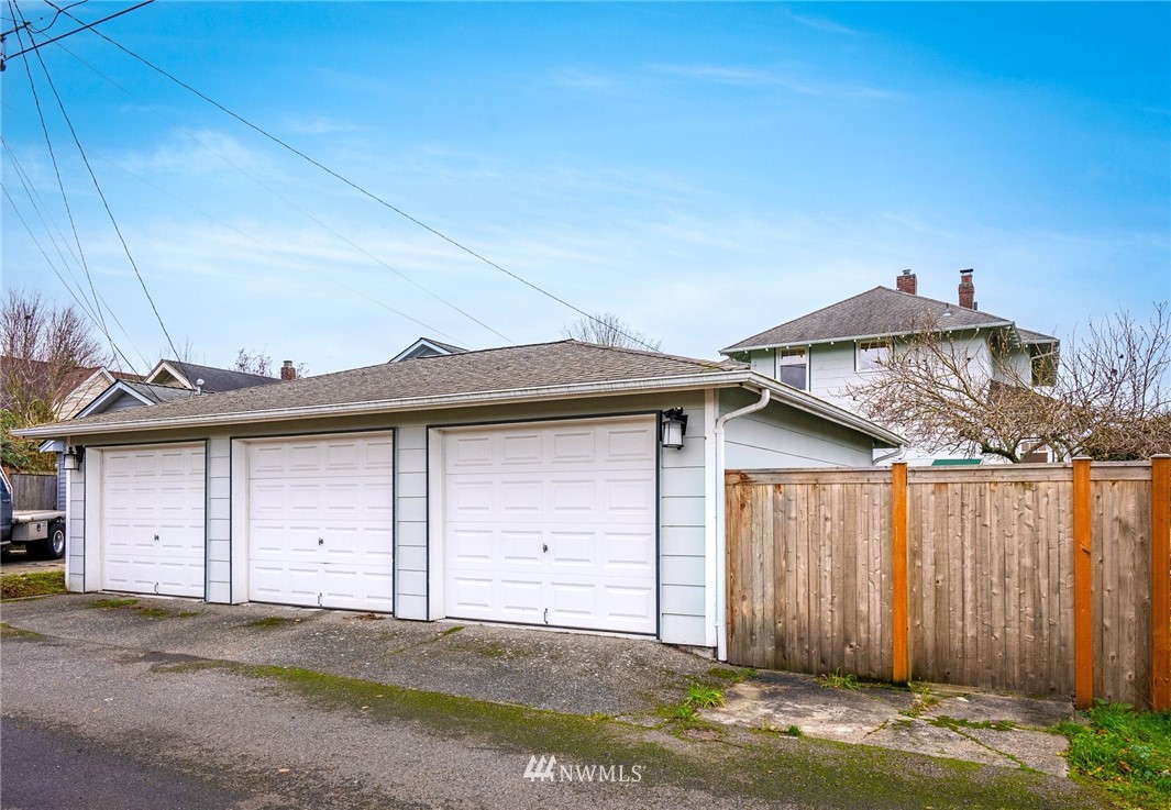 1509 Rucker Avenue Everett, WA 98201 - Photo 29 of 39 a view of a wooden house with a yard and large window