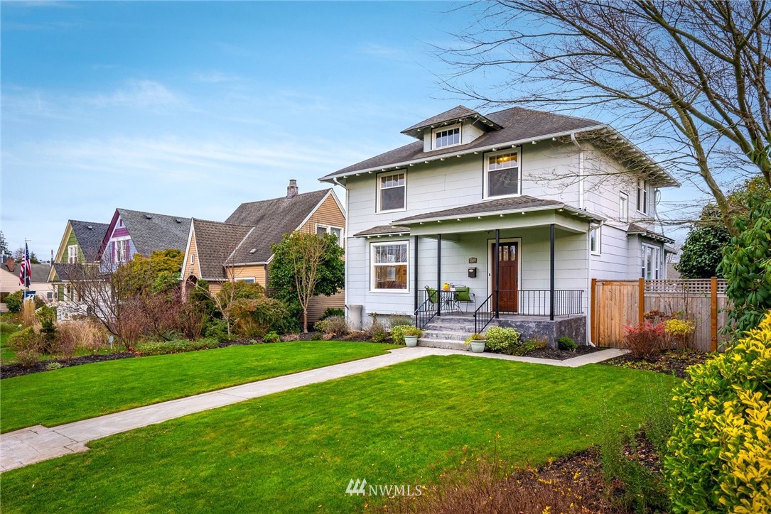 1509 Rucker Avenue Everett, WA 98201 - Photo 37 of 39 a front view of a house with garden and porch