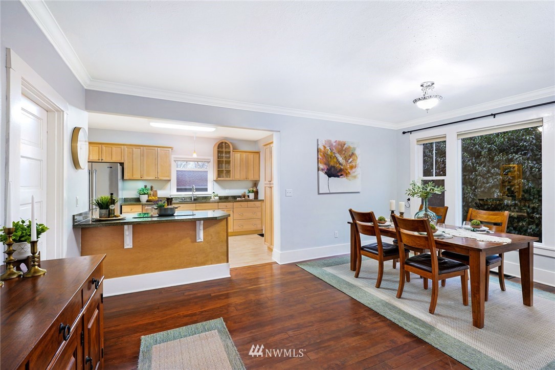 1509 Rucker Avenue Everett, WA 98201 - Photo 8 of 39 a view of a dining room with furniture window and wooden floor